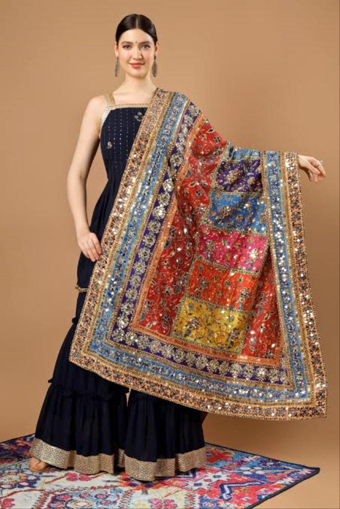 Shop now and make a lasting impression at your next event with this stunning Fancy Mirror Dupatta!

Elevate your party attire with our exquisite Fancy Mirror Dupatta, crafted from luxurious pure silk fabric. The beautiful colors, hand block print, and heavy mirror work make this accessory a statement piece for any special occasion.

Material: Pure Silk
Length: 3 Gaz
Width: 40 Inch
Design: Hand Block Print with Heavy Mirror Work
Border: Embellished with Zari and Pearl for a touch of sophistication
Ready to Wear: Comes with a side pearl border for added elegance

Transform your outfit instantly with this ready-to-wear mirror dupatta that effortlessly combines tradition with contemporary style. The intricate design, coupled with the use of premium materials, ensures a touch of luxury and sophistication.

Price: PKR 6990/-